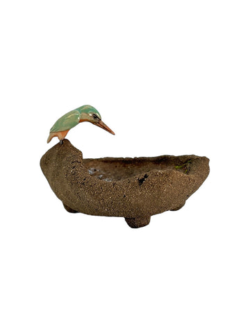 Figurine oiseau sur bassin