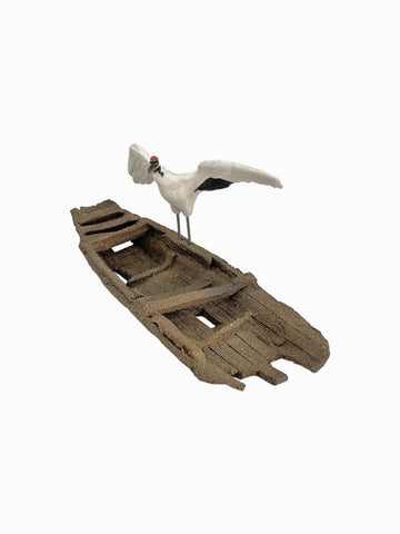 Figurine oiseau sur barque